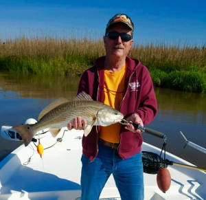 Bob Warwick with a nice red -"caught twice". The fish broke off a float rig only to be intercepted by Bob pitching a jig. This fish was released to fight another day!