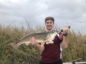 Austin Steel with a nice red! Austin caught one on a gulp swimming mullet. He and his Dad caught a variety of fish.