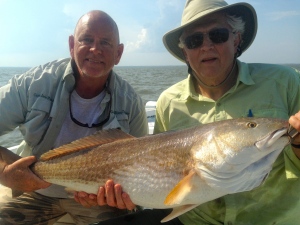 Capt. Jack and Peter Roberts with a large reddrum