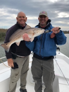 Capt. Jack and Luke Myles with a nice redfish!