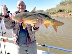 Capt. Jack is hold a fat carp that David Altschiller caught. Definitely the unusual catch of the week. The fish David and his grand son were released to fight another day.