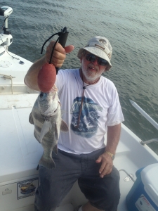 Jess with a nice black drum. Good of redfish!