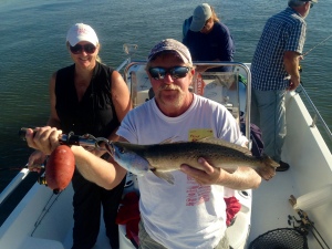 Mike Savage talking up a 21 inch seatrout wiith a popping cork!