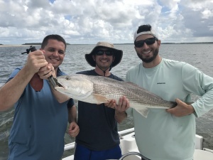 Josh, Matt & Will Seiler with the last red of the day. Will is on the right with the light green shirt. Will caught this fish on a dead shrimp under an adjustable popping float.