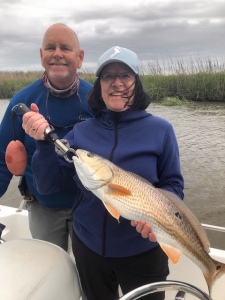 Jeanne Dockery with an over the slot red. Capt. Jack is next to Jeanne. Nice One!