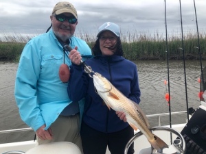 Doug & Jeanne Dockery catching nice black drum and reds on a windy day!