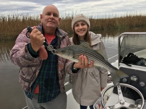 Capt. Jack & Nicole with a striper.