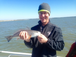 Steve Knutsen & family catching and releasing some reds and sea trout on another windy winter day. Nice Bite!