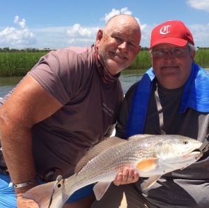 Dennis Loewer & Capt. Jack with a nice red!