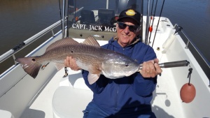 Tom Galyean with a nice red! Tom and I catching some fish on a windy day.