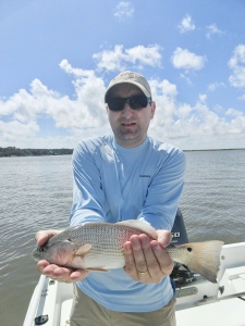 Peter Roder catching & releasing his first redfish.