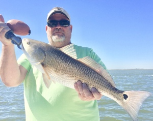 Baron Swafford catching a nice red on a new penny Bass Assassin jerk work. Baron was a nice bite of specks & reds.