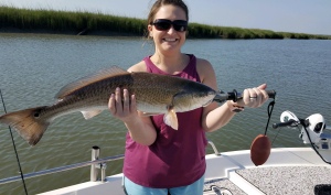 Tory Reardon with an over the slot red. She and her husband Zeke caught several nice sea trout. Good on a hot day.