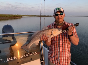 Tom Chow with a nice redfish! The currents were gentle. The reds were caught on light 1/8 jigs.