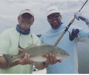 Capt. Jack McGowan holding a nice red caught by Capt.Armando Alejo. Armando fishes the Everglades National Park. Nice red!