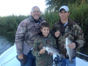 Capt. Jack, Caleb and John with some schoolie reds