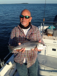 Capt Jack and Cathy catching schoolie reds