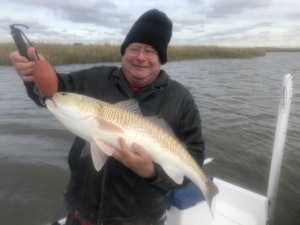 John Weathers with one of several large reds he caught and released.