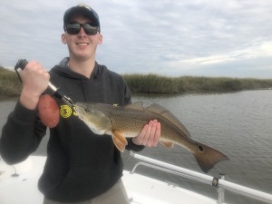 Brandon catching & releasing a nice red.