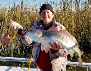 Capt. Jack with a large red caught on 1/8oz. jig.
