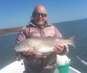 Capt. Jack with a nice winter time red. Pitching plastics on the flats.