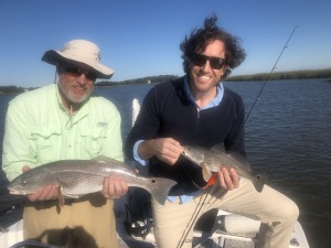 John & JT Prather with a couple of reds.  John is holding the larger one.