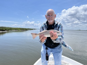 Capt. Jack with a schoolie red.