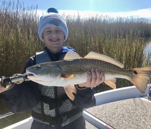 Young fisherman Raymond DeFabio catching & releasing a nice red!