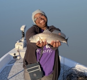 Coretta with a nice redfish!  Jeff & Coretta on a nice redfish & sea trout bite!