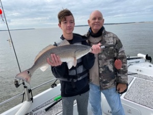 Clinton  Dunagan  & Capt. Jack with a nice red!