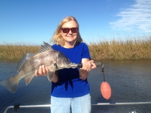 Cathy McGowan with a black drum.