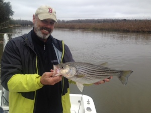 Jim with a fat striper.
