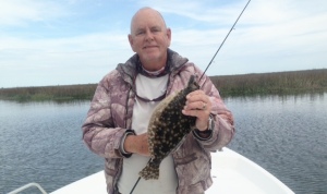 Capt. Jack & Cathy pitching voodoo shrimp. I'm a 15" flounder.