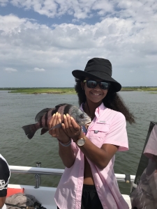 Camille with a black drum.