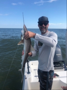 Chris Sansing catching and releasing an Atlantic sharp nose shark.