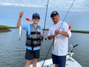 Joshua & his dad Josh with a couple of sea trout.