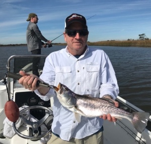 Rick Walsh & his son's catching some sea trout. Rick is holding a big one!