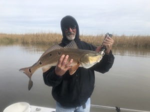 Kyle Luther with a large redfish.