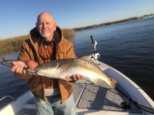 Capt. Jack with a nice red.