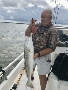 Capt. Jack holding a big red.