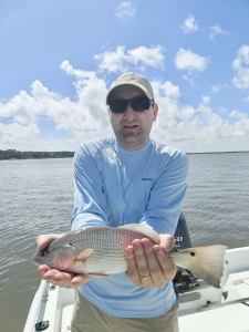 Peter Roder catching & releasing his first redfish.
