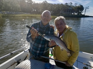 Tina Edwards catching & releasing a large sea trout. Although its fall sea trout are already starting to show roe.