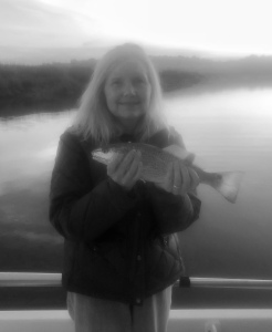 Cathy McGowan catching & releasing a schoolie red at of the day.