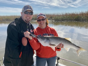Kris & wife with a nice striper!