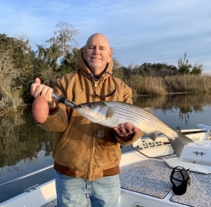 Myself (Capt. Jack) with a striper.  Cathy & I caught  & released some reds late on a Sunday afternoon.