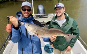 Brother in law Rob holding a large red. Nice Fish!
