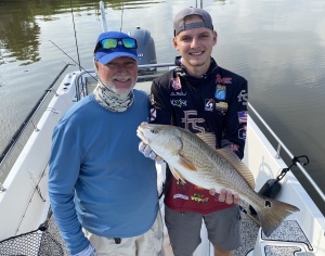 Billy & son Luke Watkins.  Luke is holding a dandy!