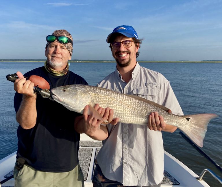 Capt. Jack & Brett Gressly with a nice red! Brett caught & released a ...